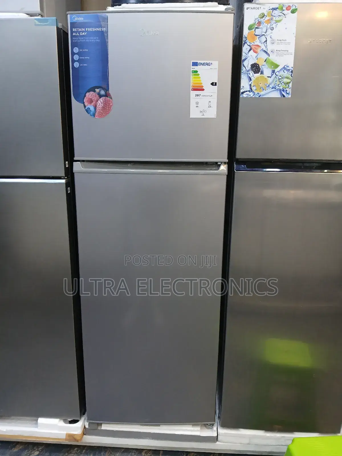 Midea Top-Freezer Refrigerator in a Silver Finish. The Unit Features