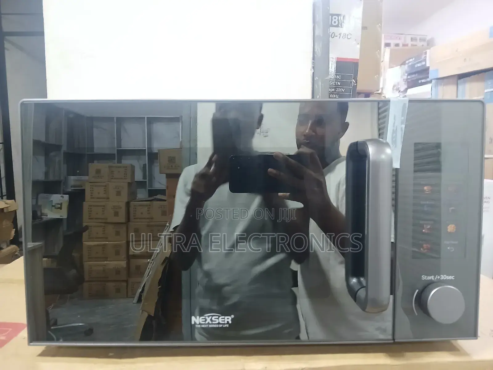 Microwave Oven Nexser Brand 20-Liter With a Silver Finish