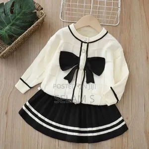 Knitted Cardigan and Pleated Skirt Set