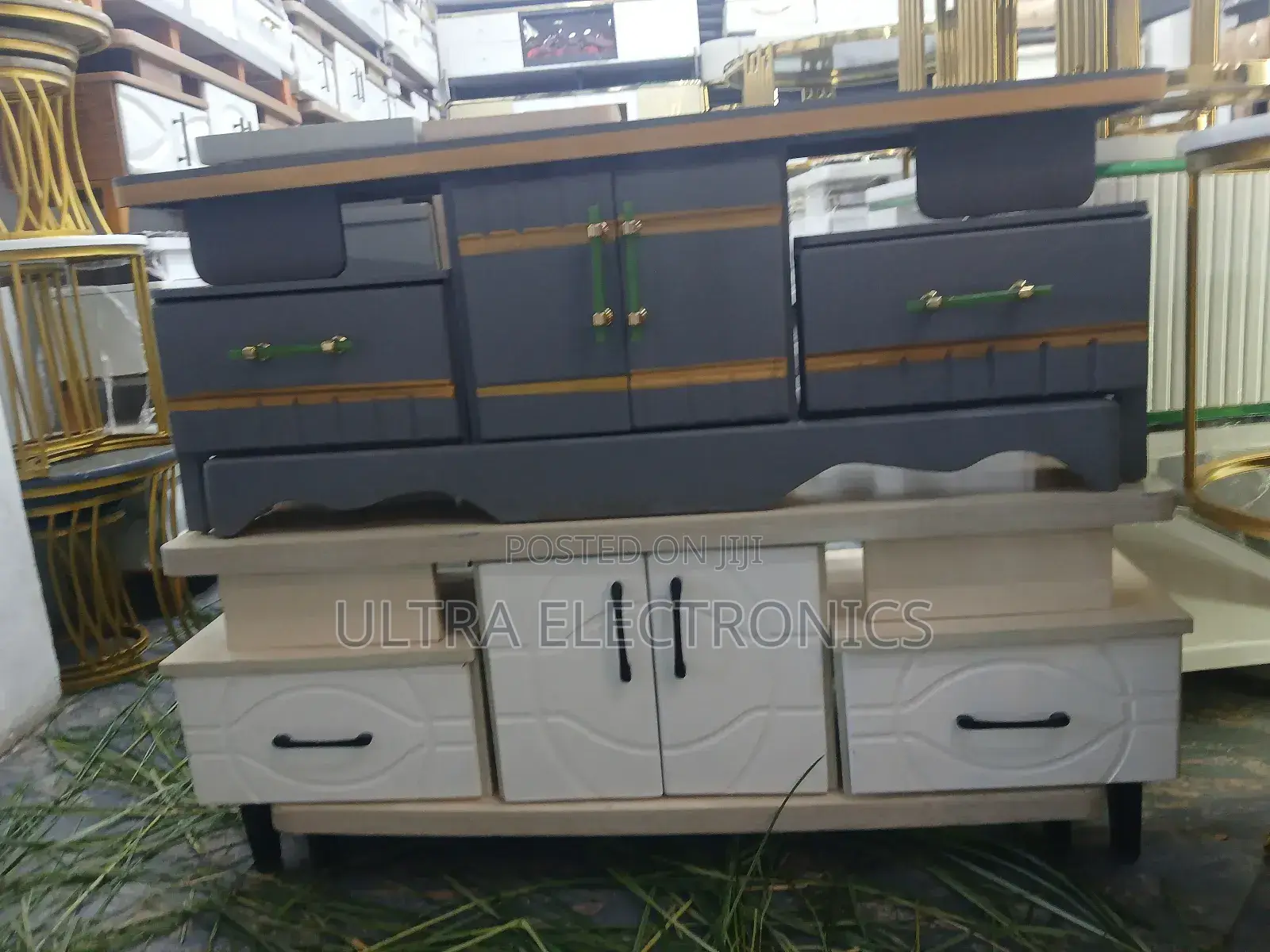 Tv Stand Featuring A White Lower Cabinet With A Textured Drawer Front