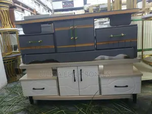 Tv Stand Featuring A White Lower Cabinet With A Textured Drawer Front