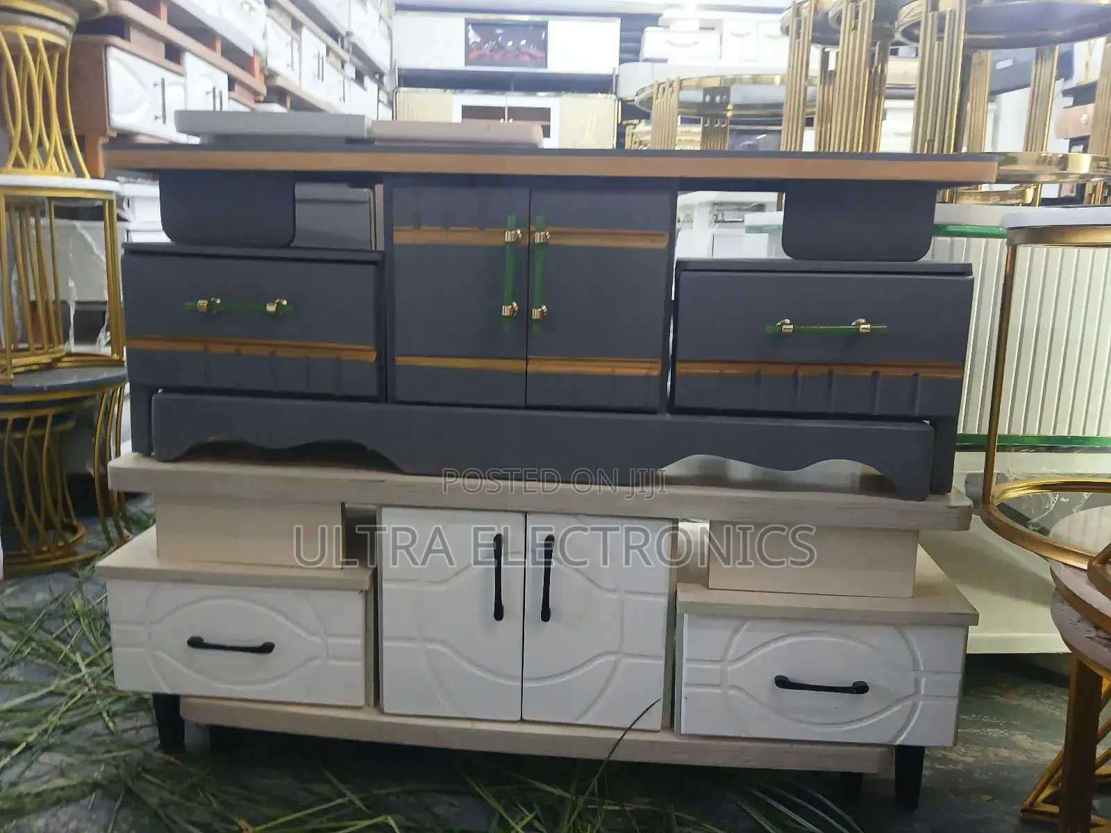 Tv Stand Featuring A White Lower Cabinet With A Textured Drawer Front