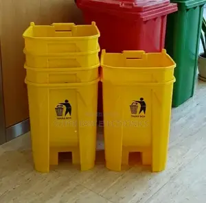 Stacked Yellow Trash Bins and Recycling Station
