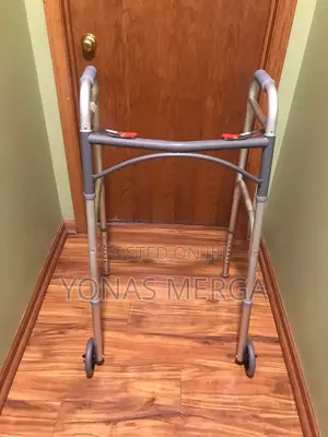 Durable Folding Walker With 2 Wheels by McKesson. It Boasts An