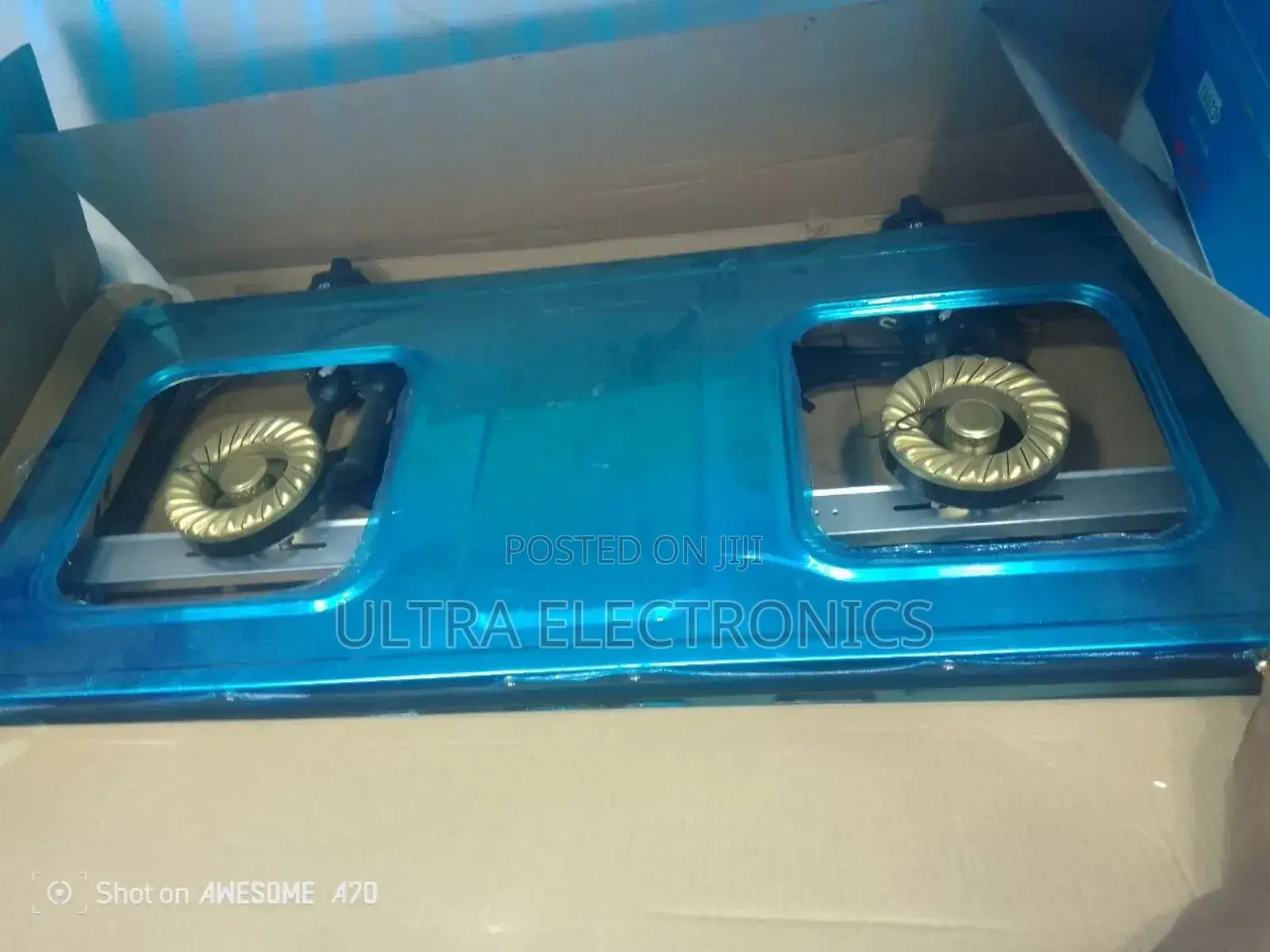 Gas Stove Zhonyi Brand Packaged in a Blue Box Featuring the Slogan
