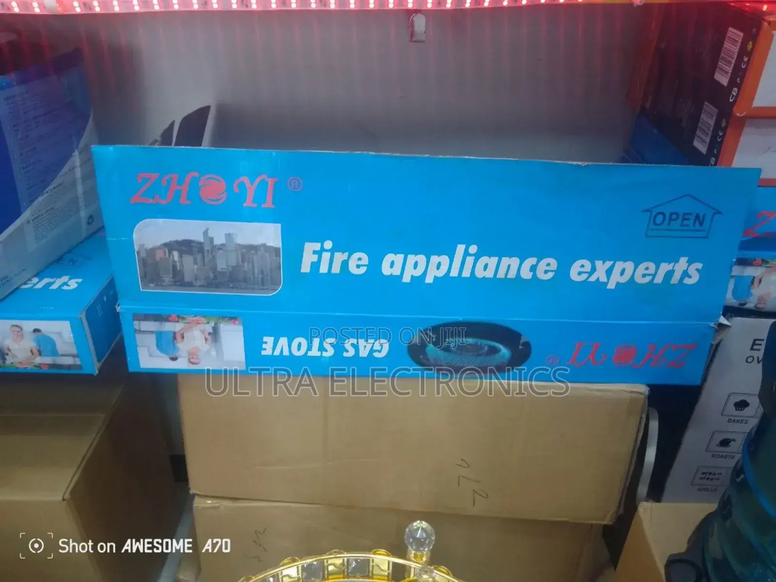 Gas Stove Zhonyi Brand Packaged in a Blue Box Featuring the Slogan