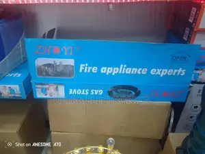 Gas Stove Zhonyi Brand Packaged in a Blue Box Featuring the Slogan