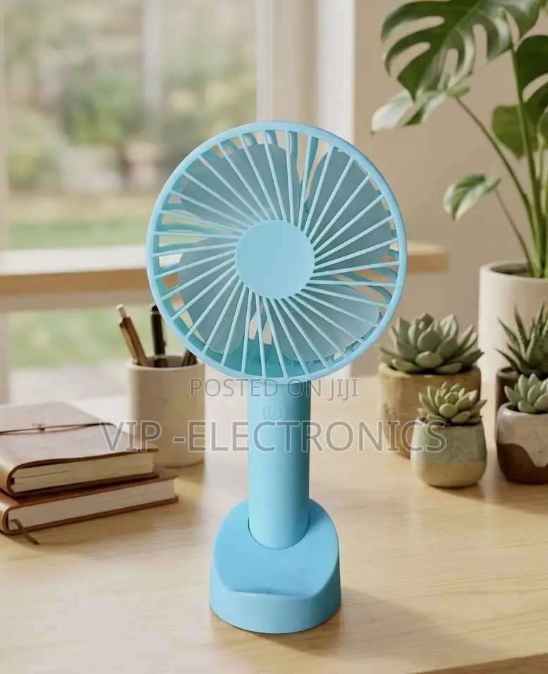 Twin Mint Green Handheld Fans on a Bathroom Vanity