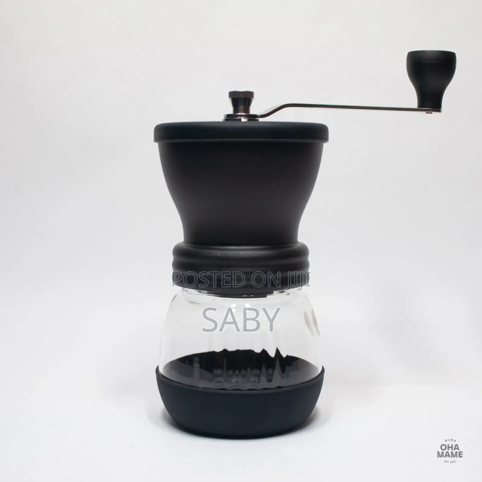 Manual Black Coffee Grinder With a Clear Glass Jar. [1, 2]