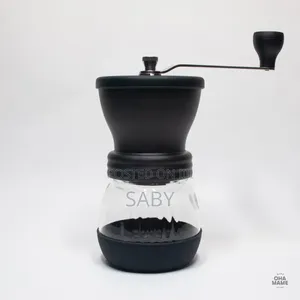 Manual Black Coffee Grinder With a Clear Glass Jar. [1, 2]
