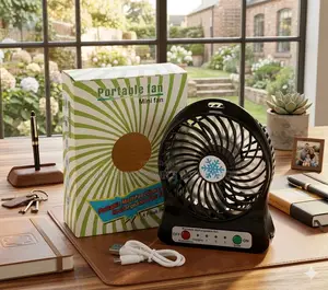 Portable Rechargeable Mini Desk Fan With Packaging and Accessories On