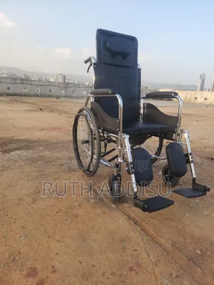 Appears to Be a High-Back Reclining Wheelchair With a Commode Function