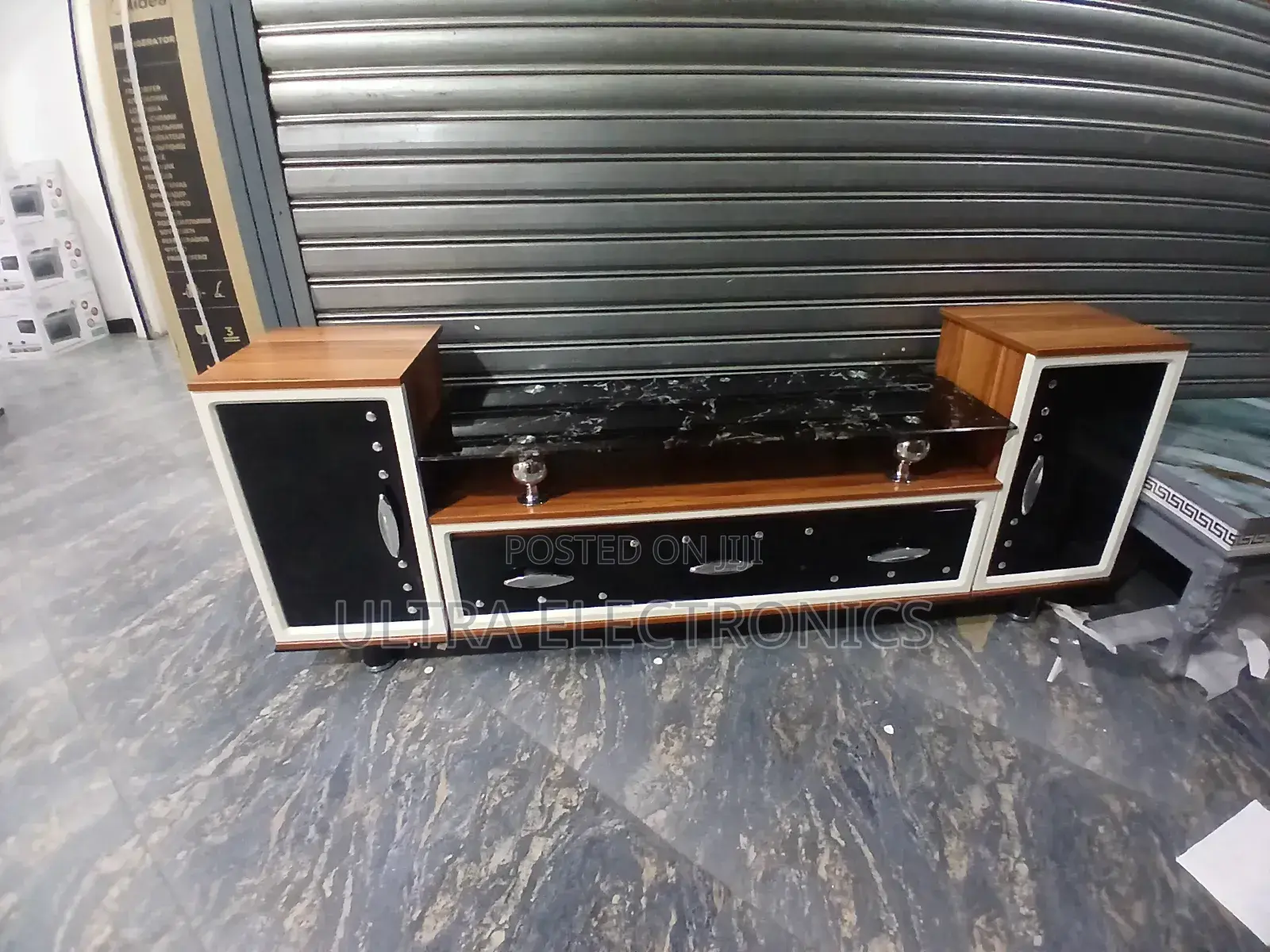 Tv Stand Features A Striking Black Marble-patterned Glass Top