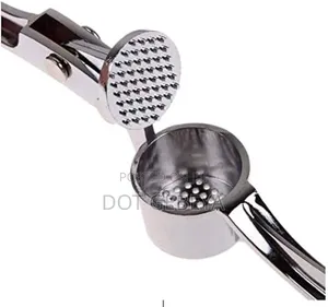 Stainless Steel Tool Is Designed to Crush Garlic and Kitchen Use.