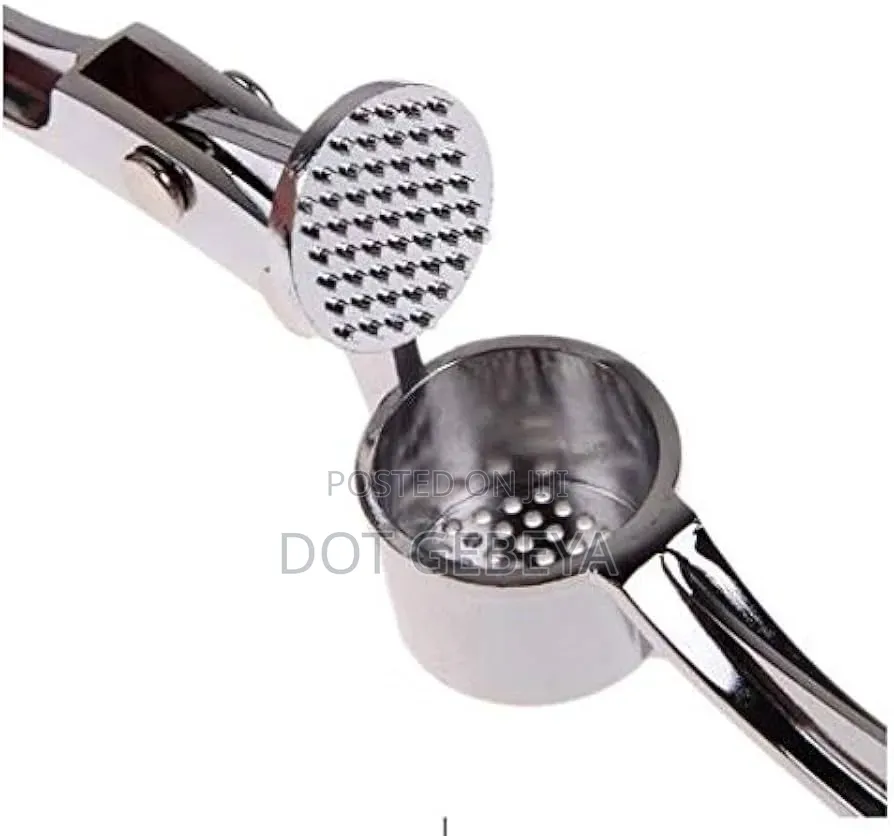 Stainless Steel Tool Is Designed to Crush Garlic and Kitchen Use.