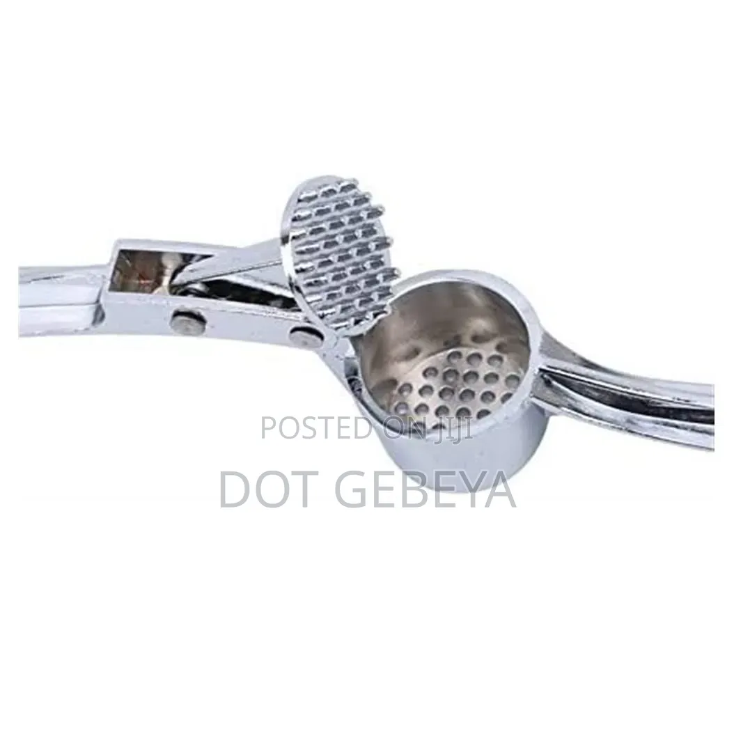 Stainless Steel Tool Is Designed to Crush Garlic and Kitchen Use.