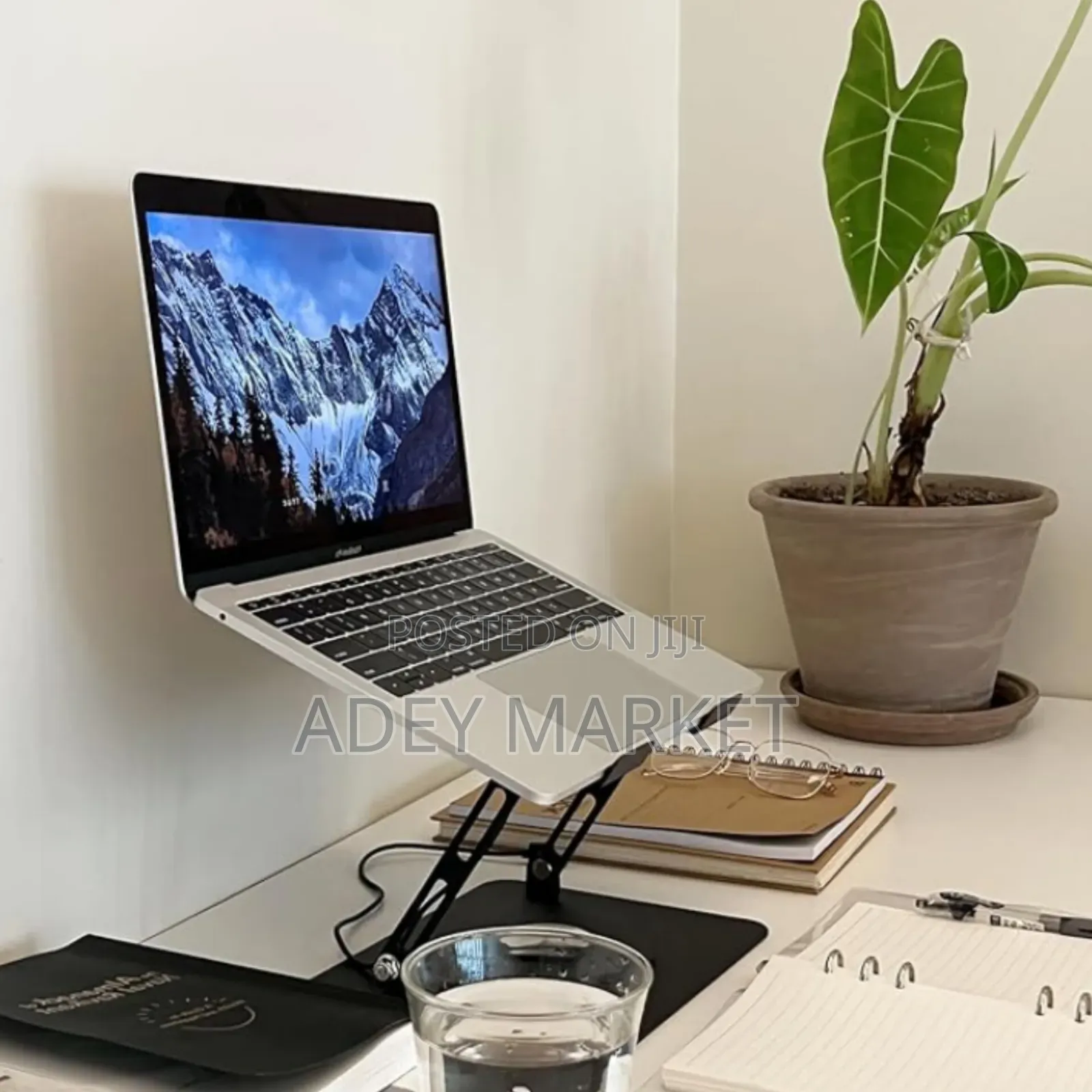 .Laptop Stand Fan With a 360 Rotating Base.