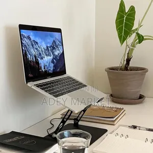 .Laptop Stand Fan With a 360 Rotating Base.
