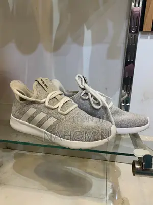 Adidas Astrastar Trainers Feature A Beige Mesh Upper With Bla