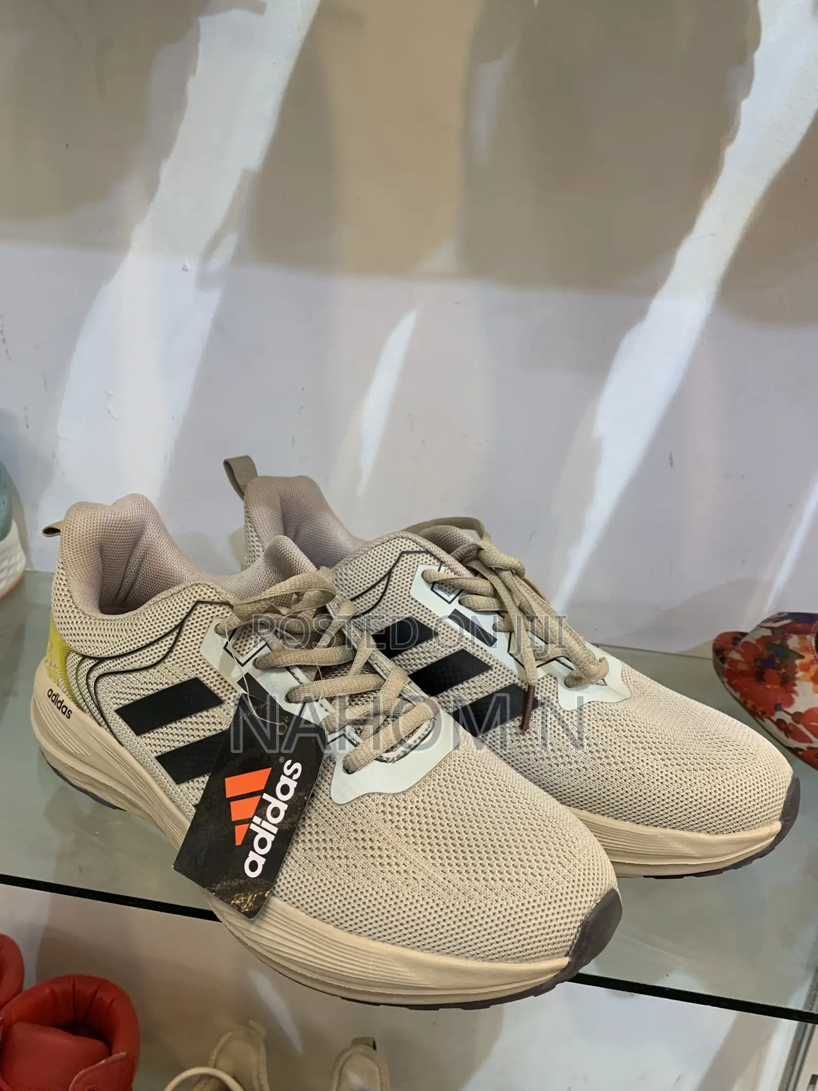 Adidas Astrastar Trainers Feature A Beige Mesh Upper With Bla