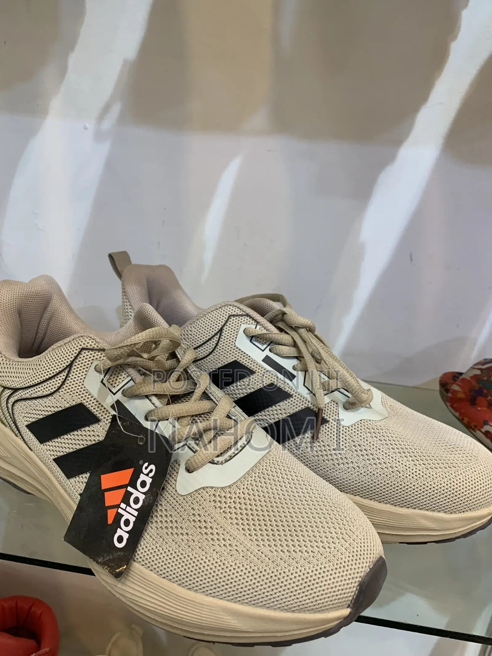 Adidas Astrastar Trainers Feature A Beige Mesh Upper With Bla