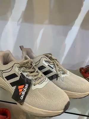Adidas Astrastar Trainers Feature A Beige Mesh Upper With Bla
