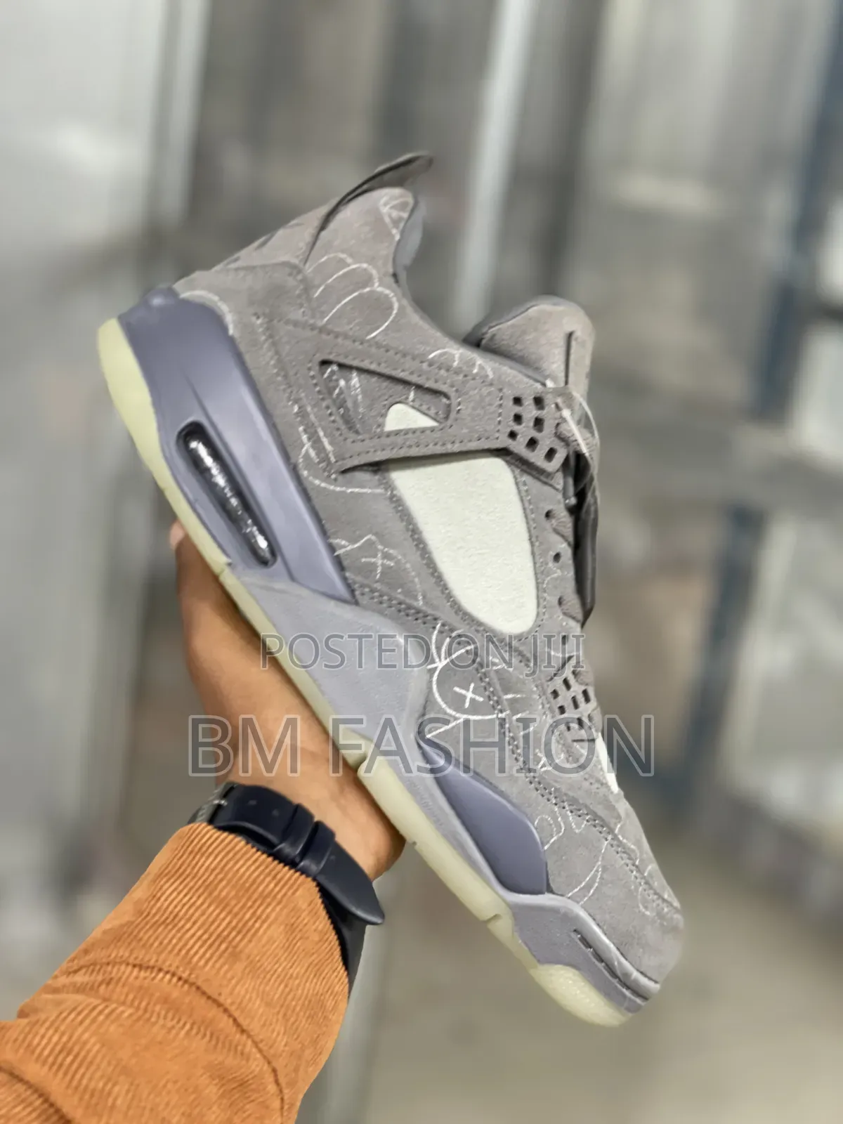 Kaws X Air Jordan 4: Premium Grey Suede