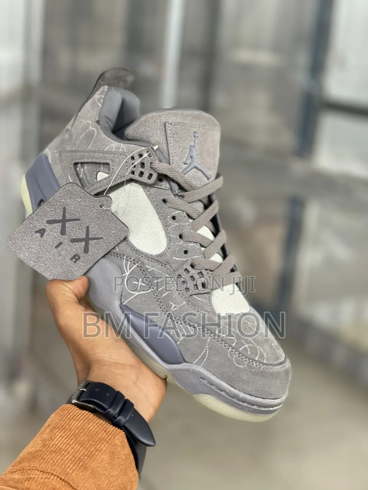 Kaws X Air Jordan 4: Premium Grey Suede