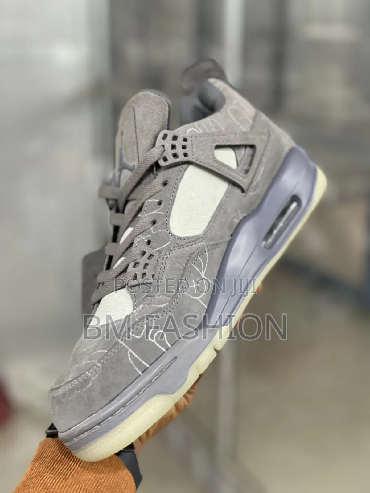 Kaws X Air Jordan 4: Premium Grey Suede