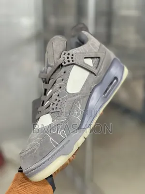 Kaws X Air Jordan 4: Premium Grey Suede