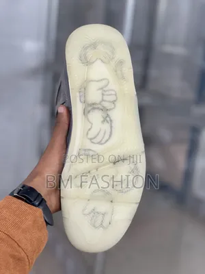 Kaws X Air Jordan 4: Premium Grey Suede