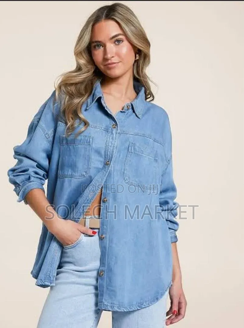 Light Blue Oversized Denim Shirt Features a Front Button Closure