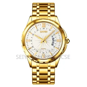 Skmei 9069 ♤ Features a Gold-Toned Stainless Steel ● Band