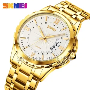 Skmei 9069 ♤ Features a Gold-Toned Stainless Steel ● Band