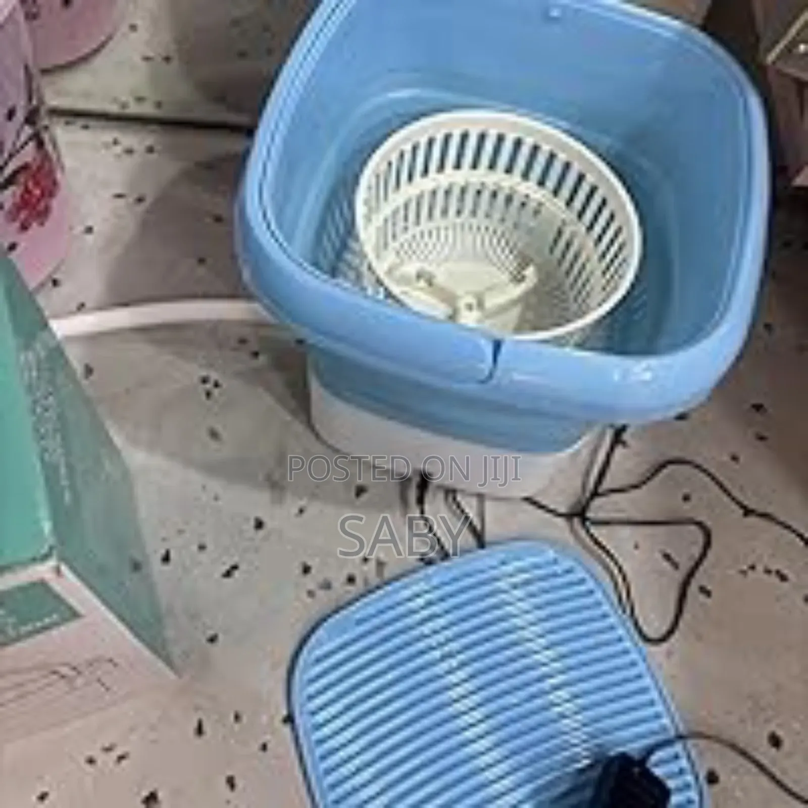Folding Washing Machine Includes a White Spin-Dry Basket