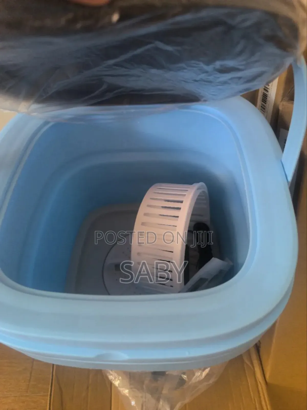 Folding Washing Machine Includes a White Spin-Dry Basket