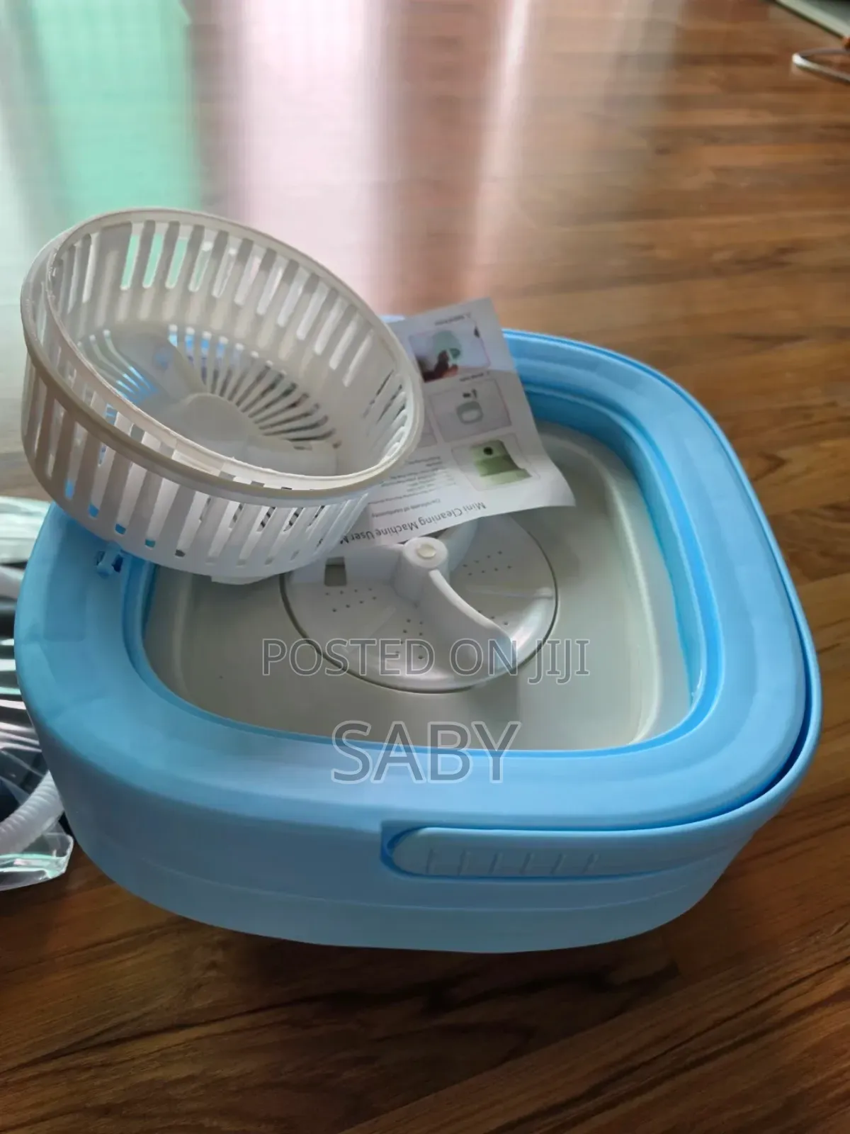 Folding Washing Machine Includes a White Spin-Dry Basket