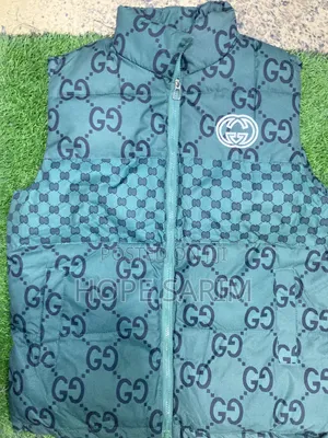 Gucci Monogram Puffer Vests: