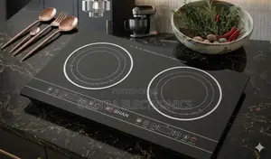 Roshan Dual Induction Cooktop Features a Sleek Black Glass Surface And