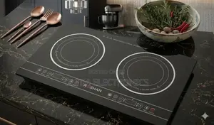 Roshan Dual Induction Cooktop Features a Sleek Black Glass Surface And