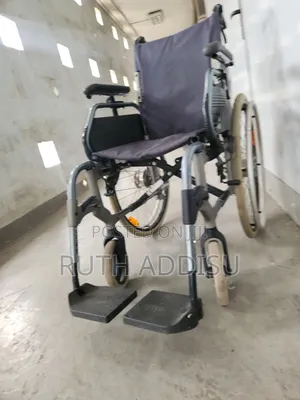 Breezy Manual Folding Wheelchair Features a Black Seat and Sturdy