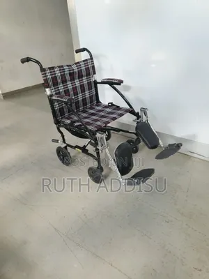 Medical Fly Lite Transport Wheelchair Features a Plaid Pattern Medical