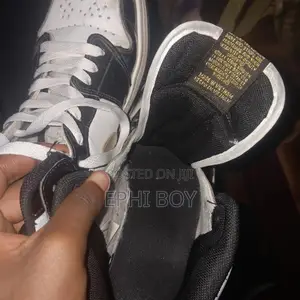 Nike Air Jordan 1 Mid in a Black/White/Metallic Gold
