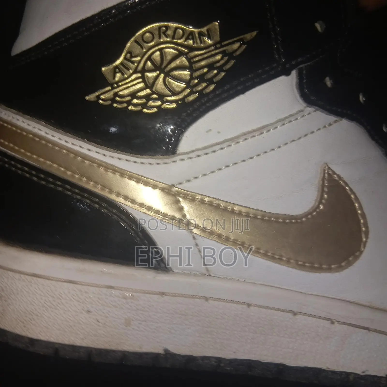 Nike Air Jordan 1 Mid in a Black/White/Metallic Gold
