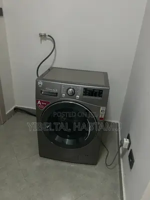 Washing Machine,Sofa and 55 Inch Tv With Background