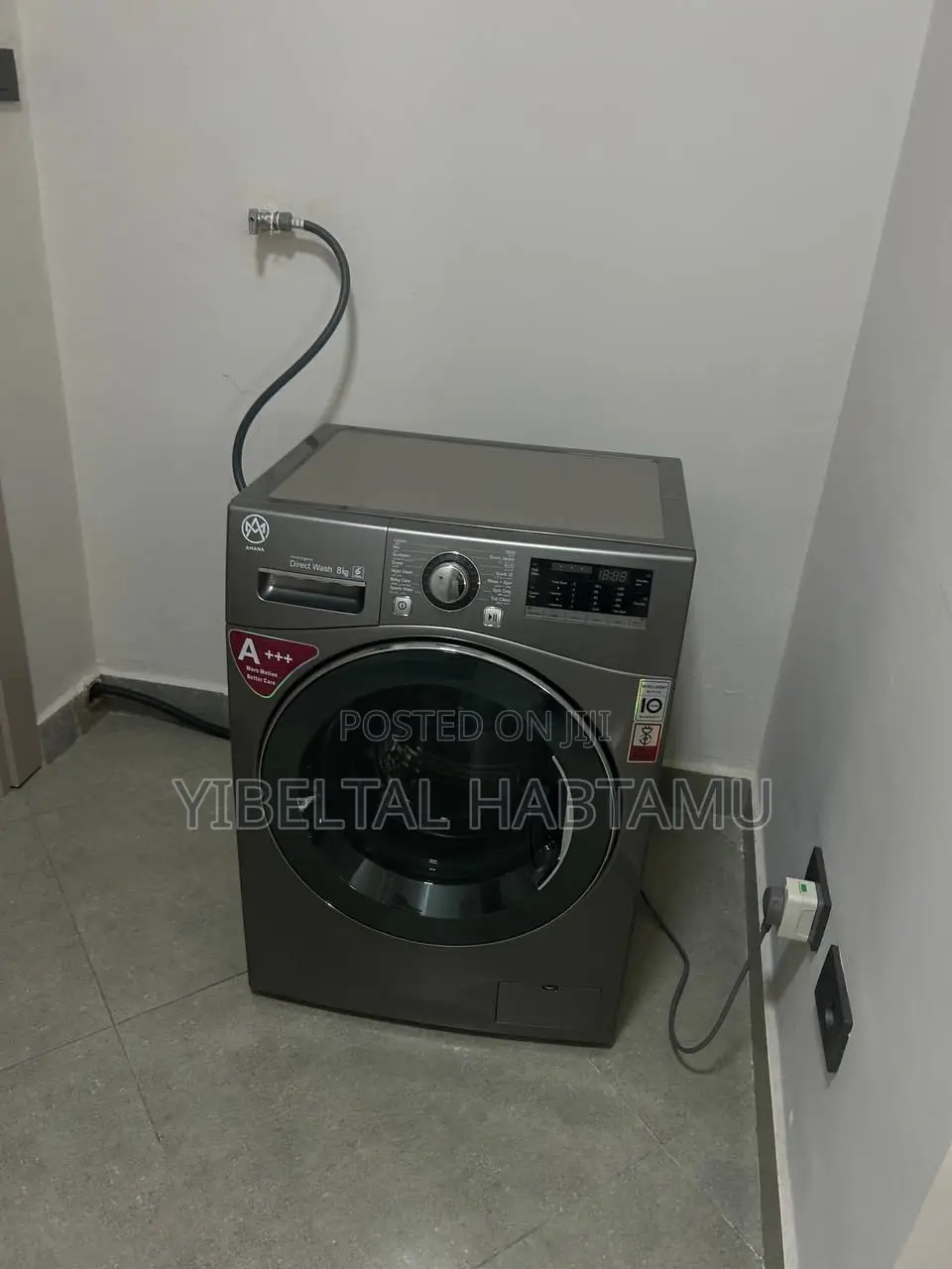 Washing Machine,Sofa and 55 Inch Tv With Background