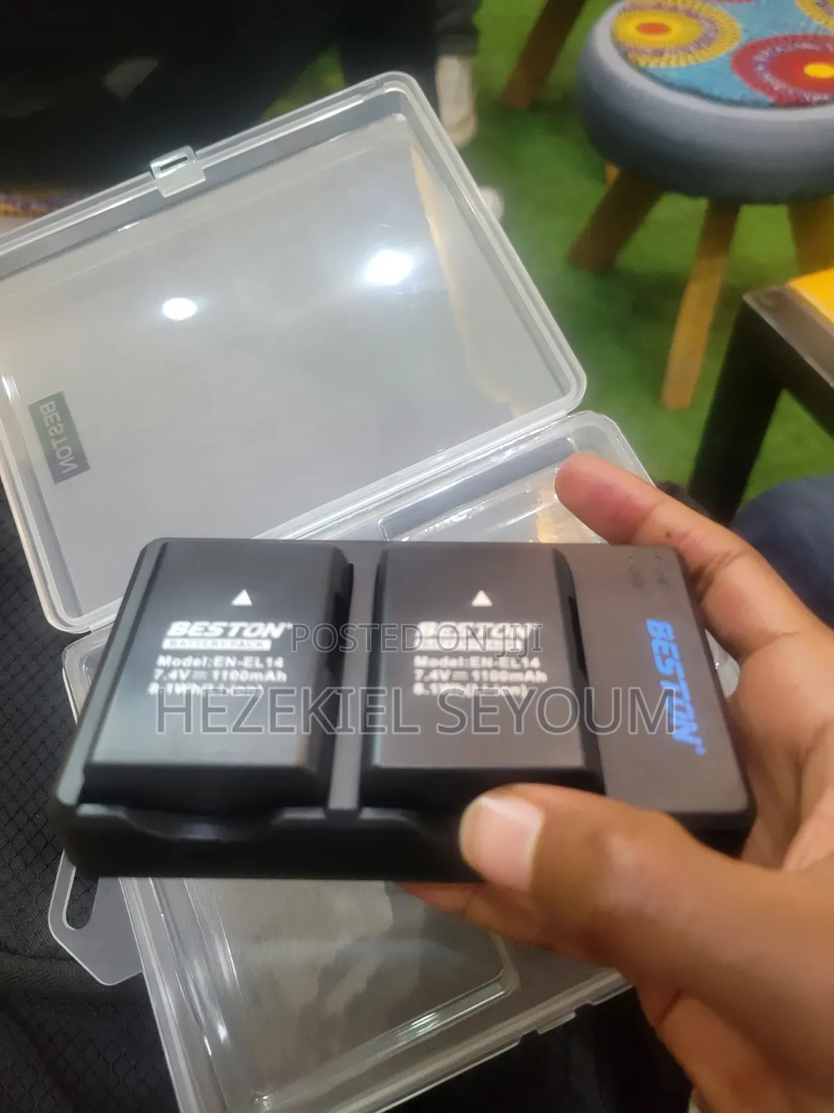 A Nikon Battery Whith a Charger