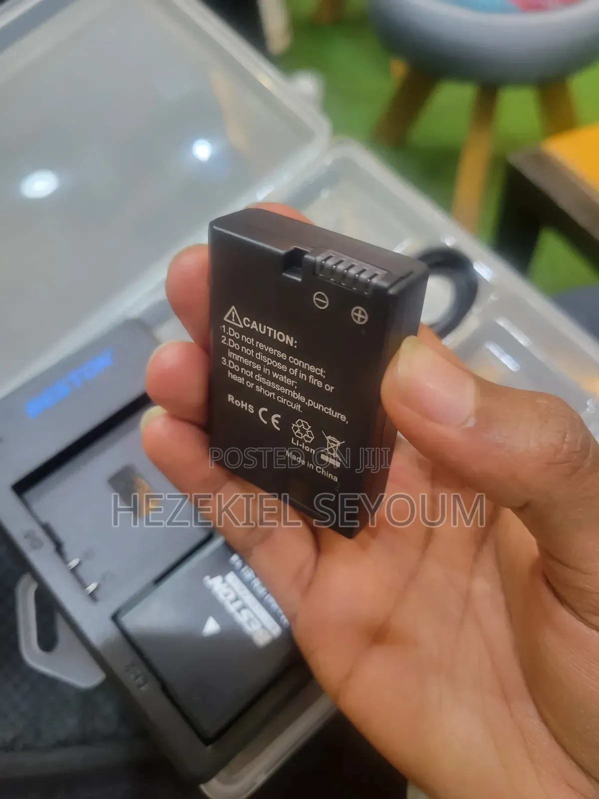 A Nikon Battery Whith a Charger