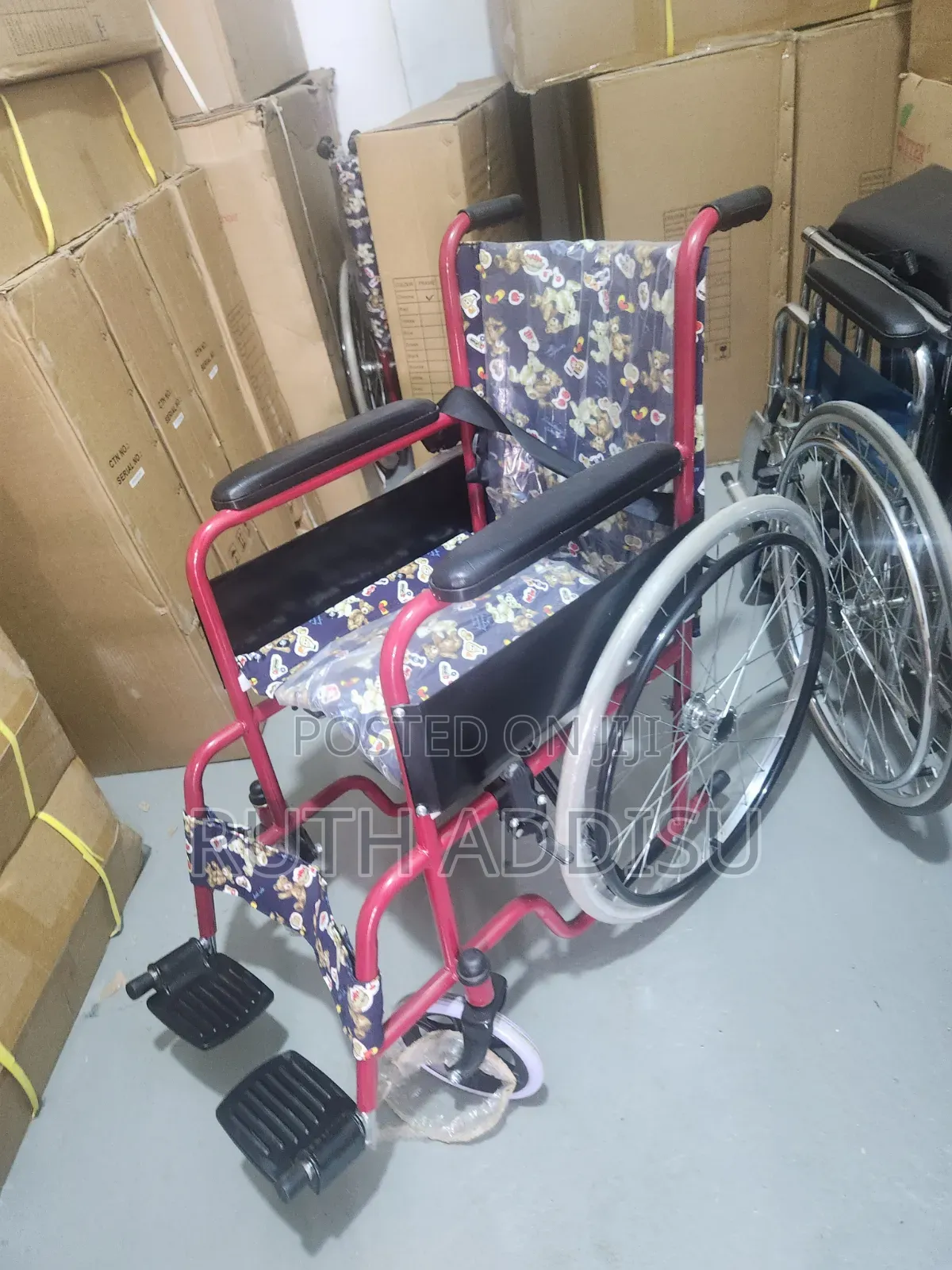 Wheelchair Features a Distinct Red Frame and Colorful Upholstery With