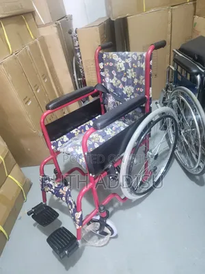 Wheelchair Features a Distinct Red Frame and Colorful Upholstery With